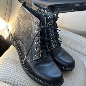 These are black leather upper/balance man made shoes for woman that look new.